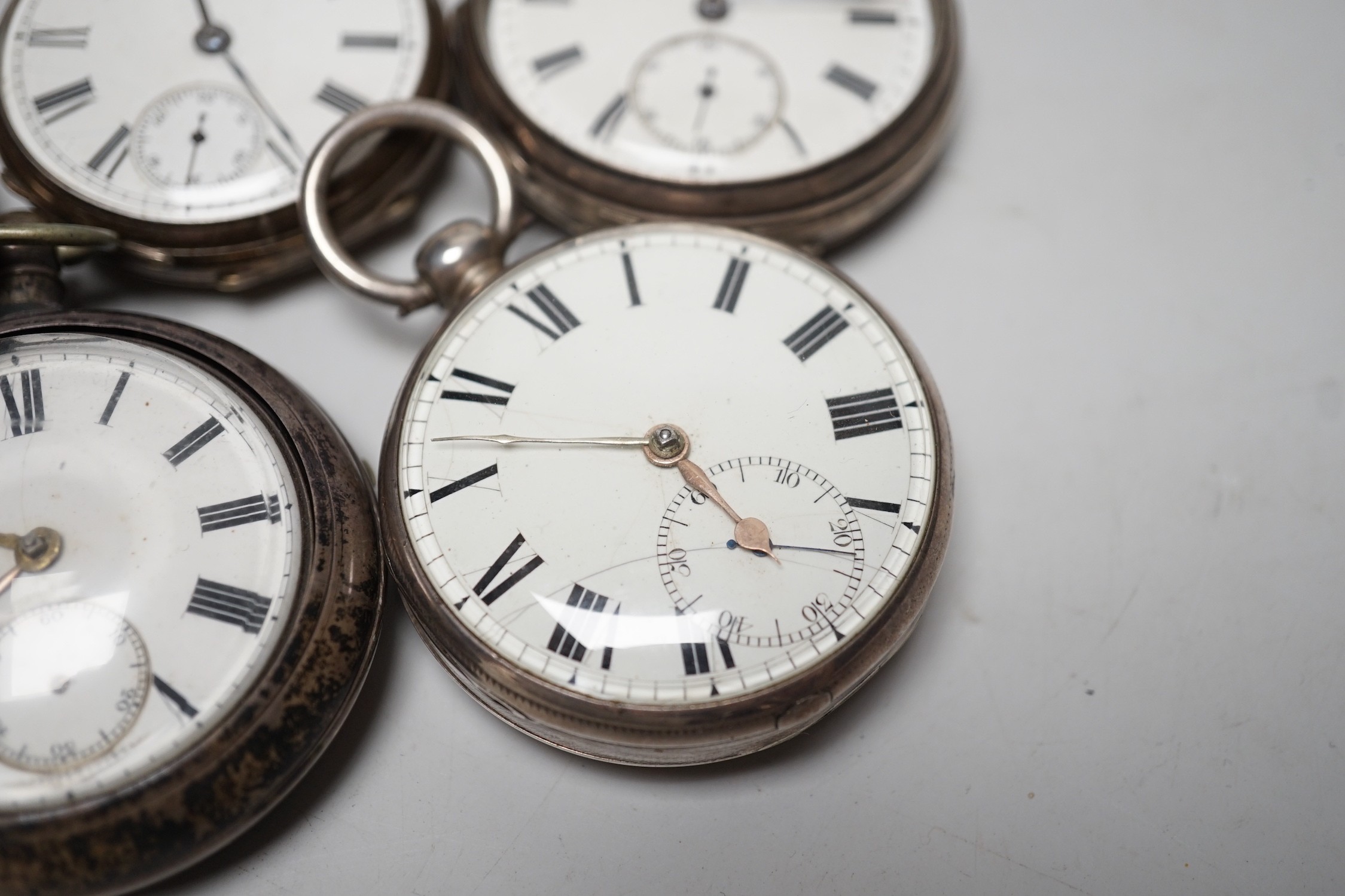 A 19th century silver pair cased keywind verge pocket watch, unsigned movement, together with three silver open faced keywind pocket watches including Fearn, Cornhill and a silver hunter pocket watch by Tanner of Lewes.